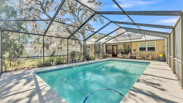 pool with a patio area, an outdoor hangout area, and a lanai