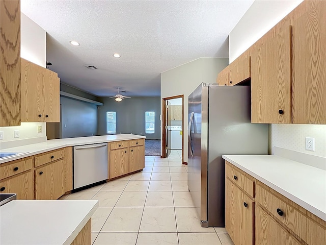 kitchen with visible vents, stainless steel appliances, a peninsula, light countertops, and ceiling fan