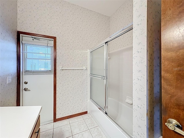 full bath with wallpapered walls, baseboards, bath / shower combo with glass door, tile patterned floors, and vanity