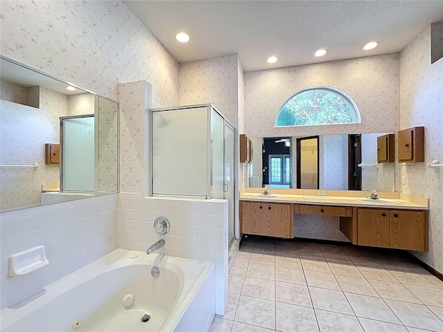 bathroom featuring wallpapered walls and a sink