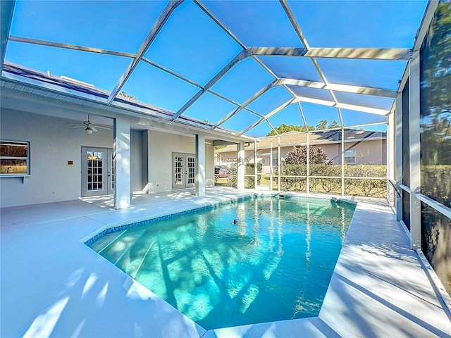 pool featuring a patio area, french doors, a lanai, and ceiling fan