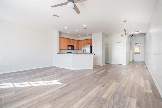 unfurnished living room with visible vents, ceiling fan, baseboards, light wood-type flooring, and recessed lighting