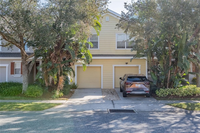 view of front of house with a garage and driveway