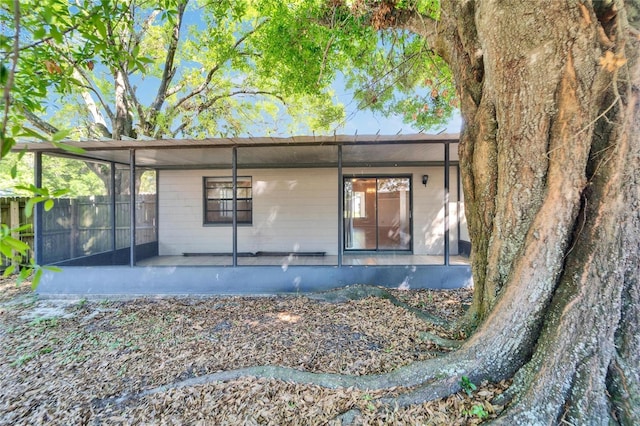 view of property exterior featuring a sunroom