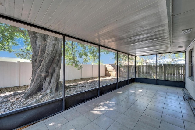 unfurnished sunroom featuring a healthy amount of sunlight