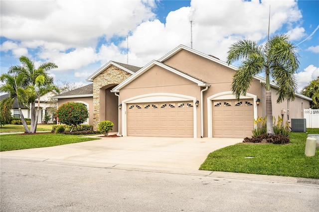 ranch-style house with a front yard, central AC unit, driveway, stucco siding, and a garage