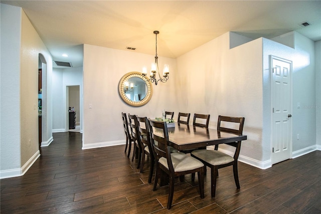 dining space with dark wood-type flooring and visible vents