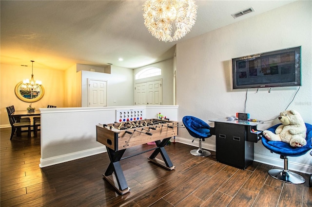 game room featuring a notable chandelier, baseboards, visible vents, and wood finished floors