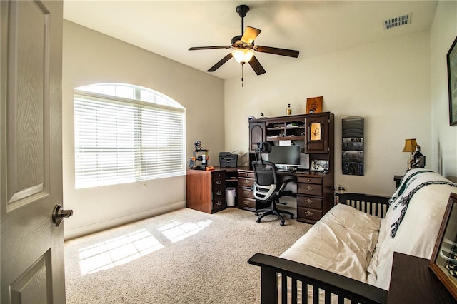 home office featuring visible vents, carpet, and ceiling fan