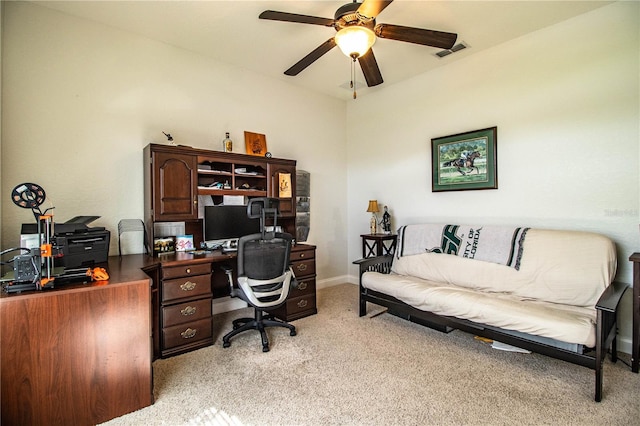 office with visible vents, light colored carpet, baseboards, and ceiling fan