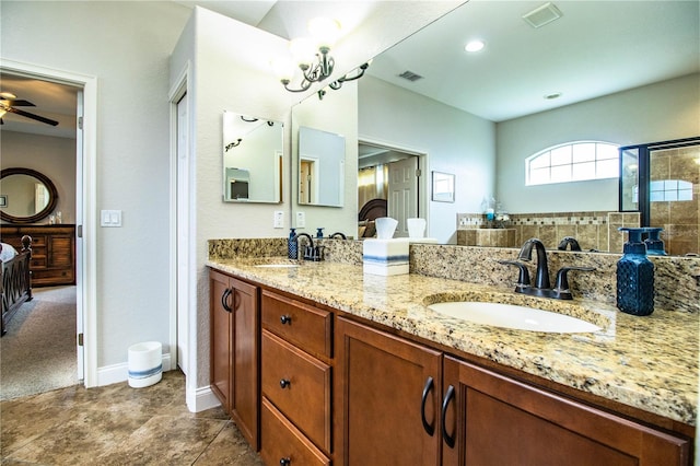 bathroom featuring visible vents, ceiling fan, and a sink