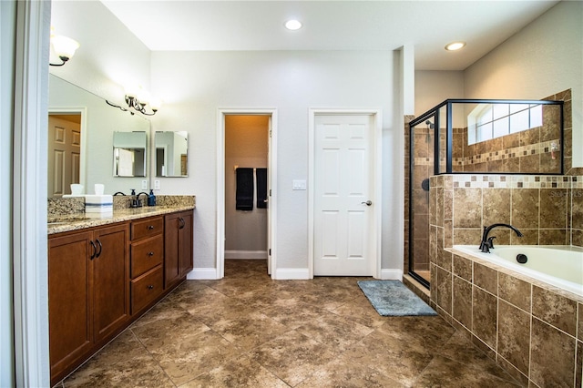 full bath with a sink, double vanity, a bath, and a shower stall