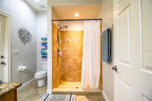 bathroom featuring baseboards, visible vents, a shower stall, tile patterned floors, and toilet