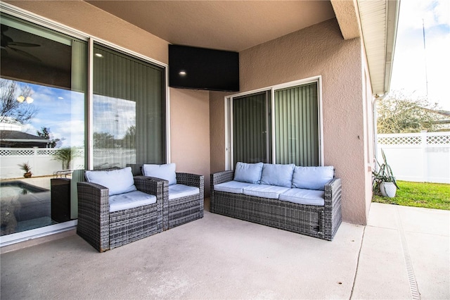 view of patio / terrace with an outdoor living space and fence