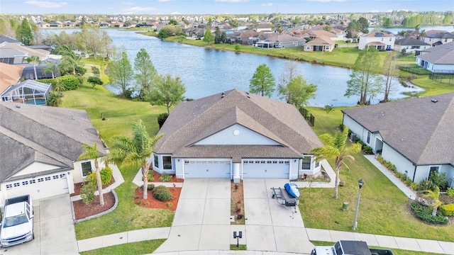 bird's eye view with a residential view and a water view