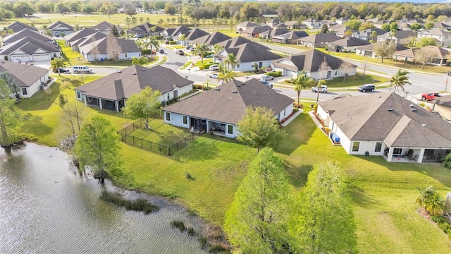 birds eye view of property with a residential view and a water view