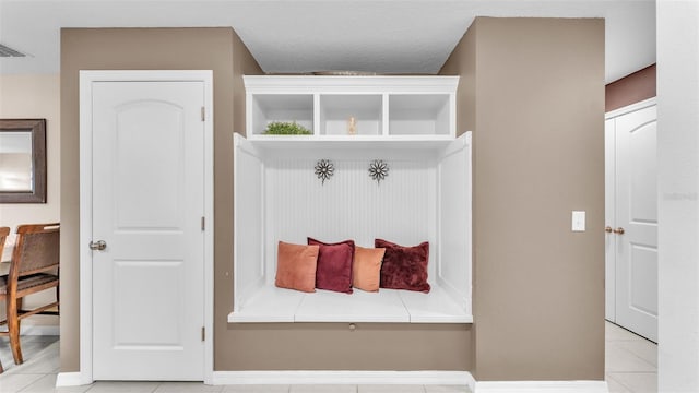 mudroom featuring light tile patterned floors and visible vents