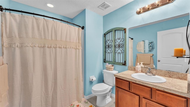 full bathroom featuring visible vents, a textured ceiling, toilet, and vanity