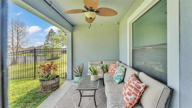 balcony featuring outdoor lounge area and a ceiling fan