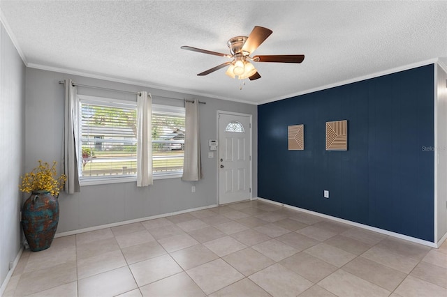 foyer featuring a textured ceiling, crown molding, light tile patterned floors, baseboards, and ceiling fan