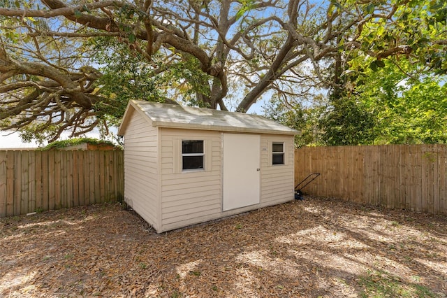 view of shed featuring a fenced backyard