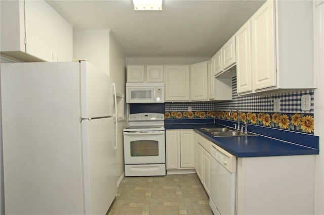 kitchen with a sink, dark countertops, white cabinetry, white appliances, and decorative backsplash