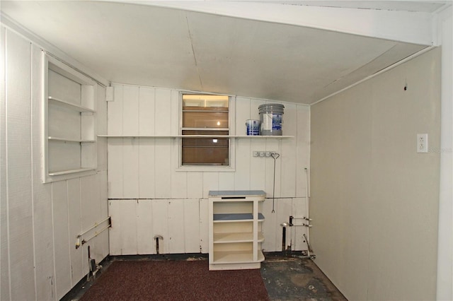 interior space featuring open shelves and white cabinets