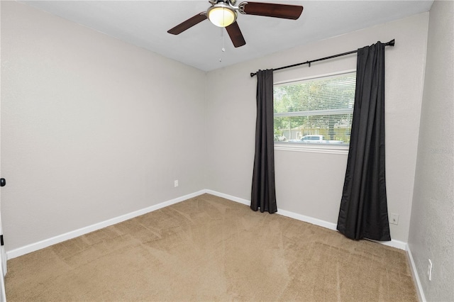 unfurnished room featuring a ceiling fan, baseboards, and carpet floors