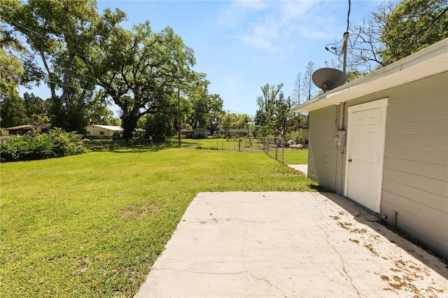 view of yard featuring a patio area and fence