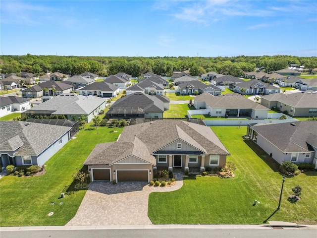 birds eye view of property with a residential view