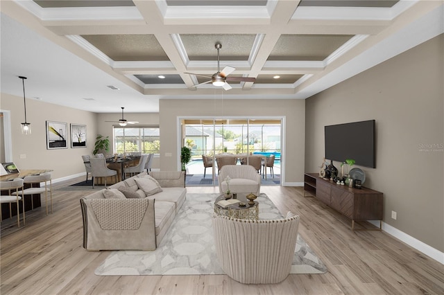 living area featuring coffered ceiling, baseboards, light wood-style floors, and a ceiling fan