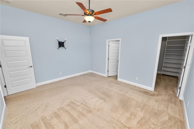 unfurnished bedroom with carpet, visible vents, and baseboards