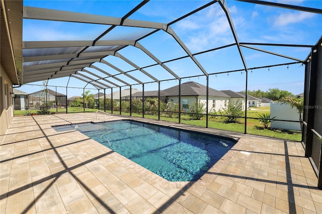 pool with a residential view, a patio, and a lanai