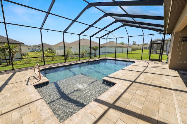 pool featuring glass enclosure, a yard, a patio area, and a residential view