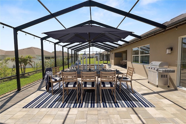 view of patio with a lanai, grilling area, and outdoor dining area