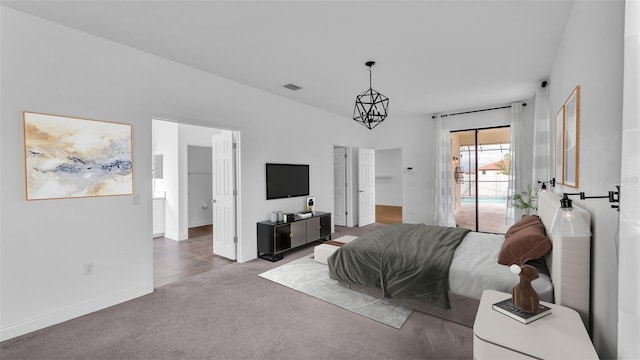 bedroom with access to exterior, visible vents, baseboards, carpet, and a notable chandelier