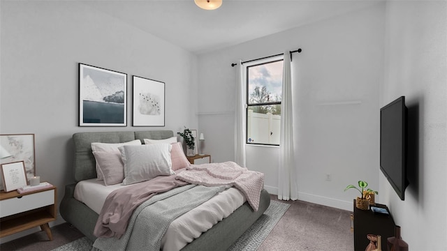 bedroom featuring carpet flooring and baseboards