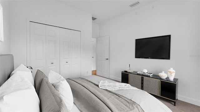 bedroom featuring a closet, baseboards, visible vents, and carpet floors