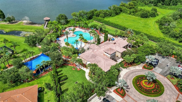 birds eye view of property with a water view