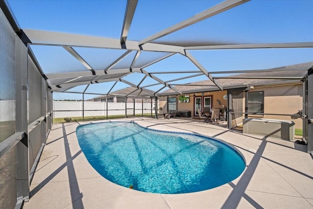 view of pool featuring a fenced in pool, a patio, a lanai, and fence