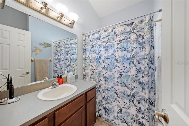 full bath with vanity and a shower with shower curtain