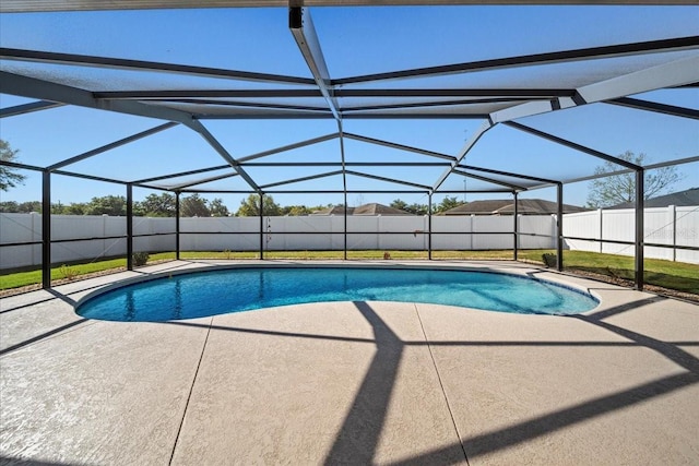 view of pool with a lanai, a fenced in pool, a patio, and a fenced backyard