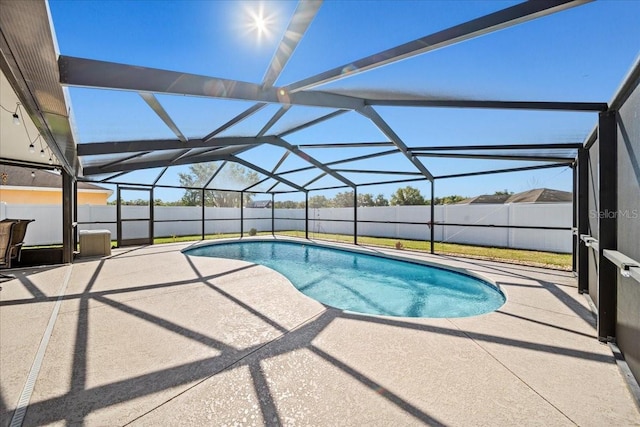 view of swimming pool featuring a fenced in pool, a patio, a lanai, and fence