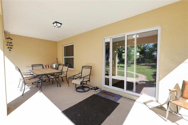 view of patio with outdoor dining area