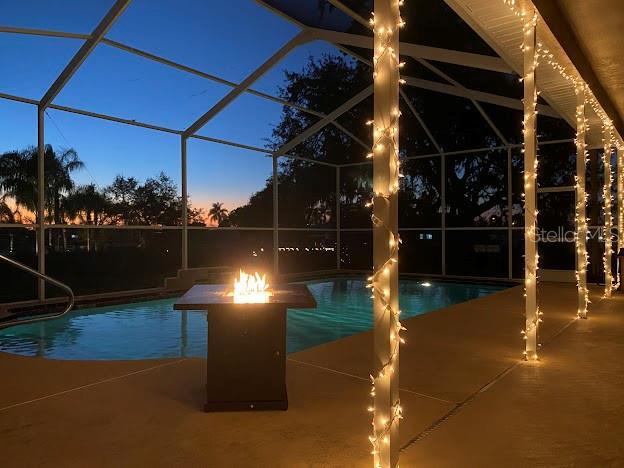 pool featuring a lanai and a patio area