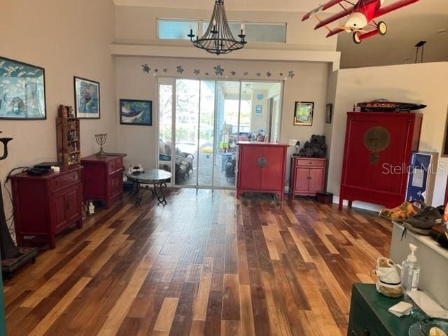 dining room with a notable chandelier and wood finished floors