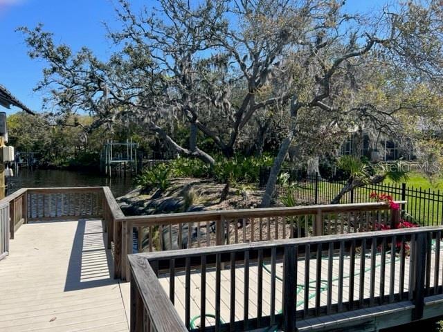 wooden deck featuring fence