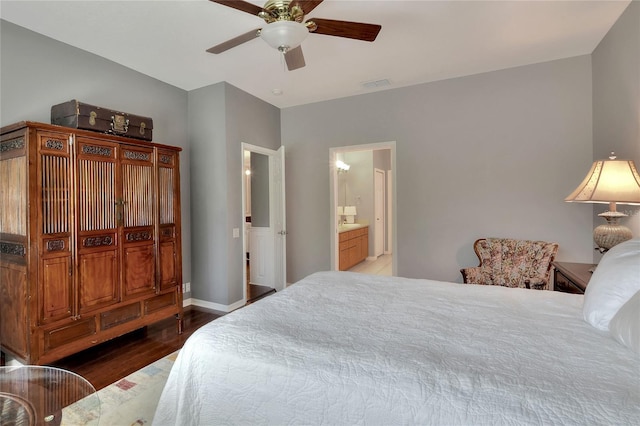 bedroom with visible vents, a ceiling fan, wood finished floors, connected bathroom, and baseboards