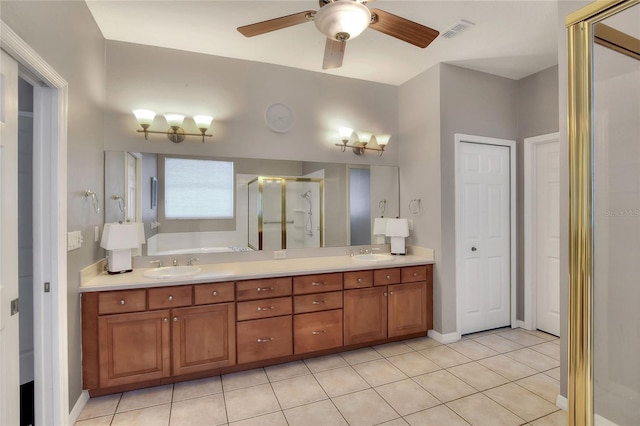 full bath featuring double vanity, visible vents, a stall shower, and a sink