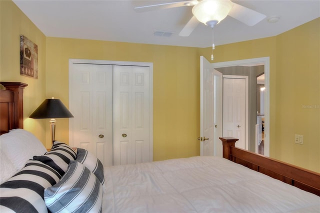 bedroom with a closet, visible vents, and a ceiling fan